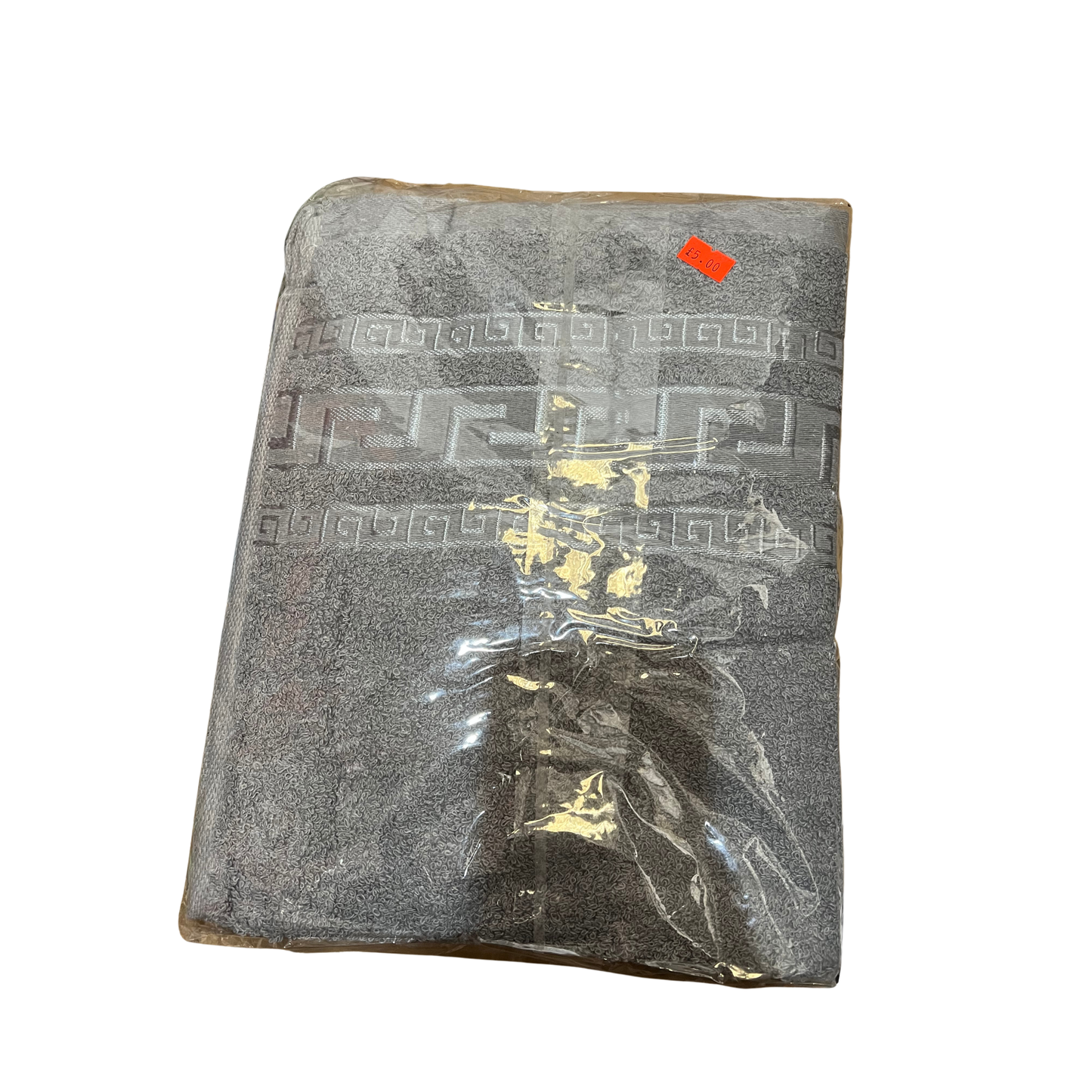 Gray textured fabric with a clear plastic bag containing small items on a white background