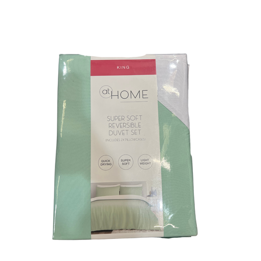 Packaged king-sized super soft reversible duvet set with 'at Home' branding on a white background.