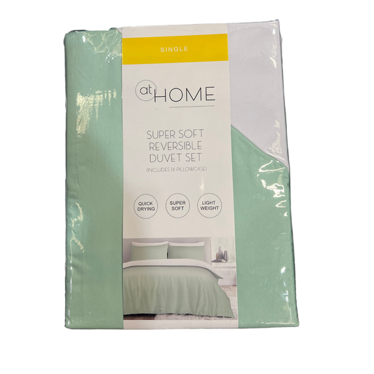 Packaged super soft reversible duvet set with 'at Home' branding on a white background