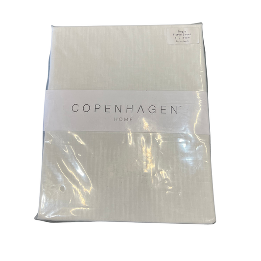Packaged white textured fabric with 'Copenhagen Home' label on a white background