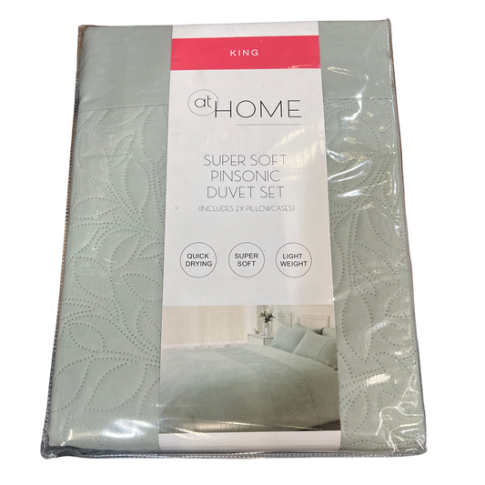 Packaged King size duvet set with 'at Home' branding on a white background