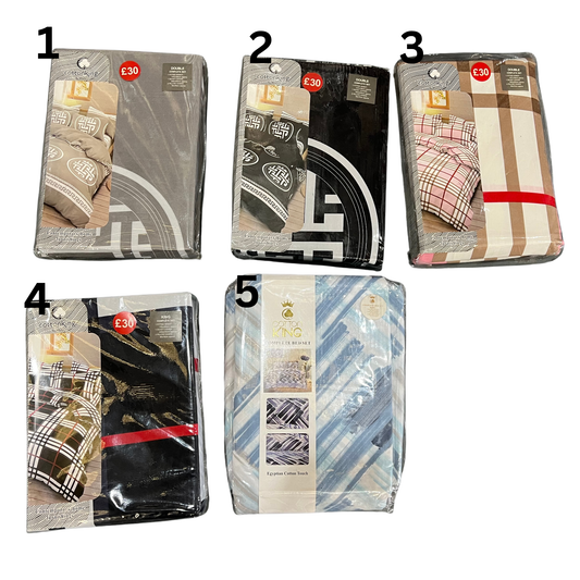 Five packages of folded blankets with different patterns and colors on a white background.