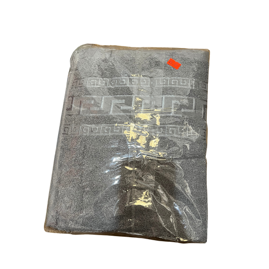 Gray textured fabric with a clear plastic bag containing small items on a white background