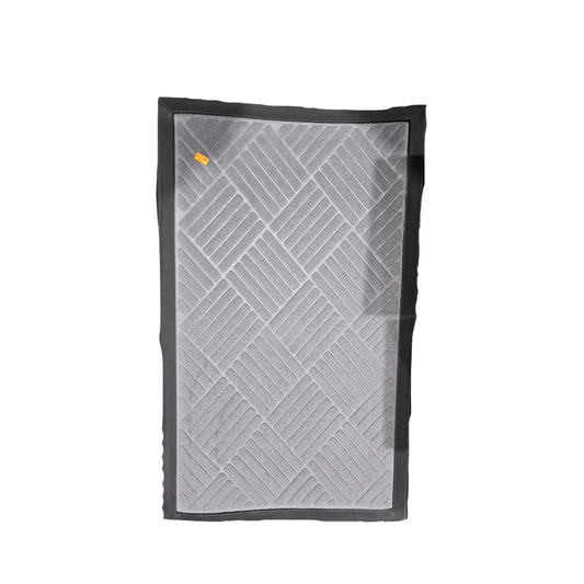 Gray quilt with black border on a white background