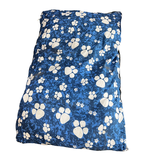 Blue blanket with white paw prints on a white background