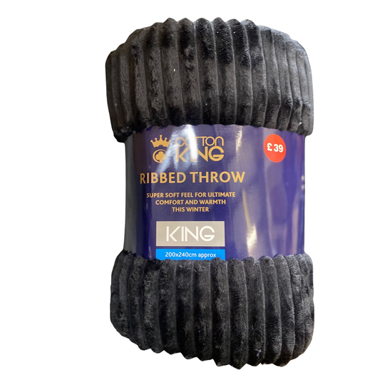 Black ribbed throw with packaging on a white background