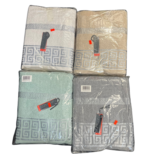 Four folded towels in different colors with packaging on a white background