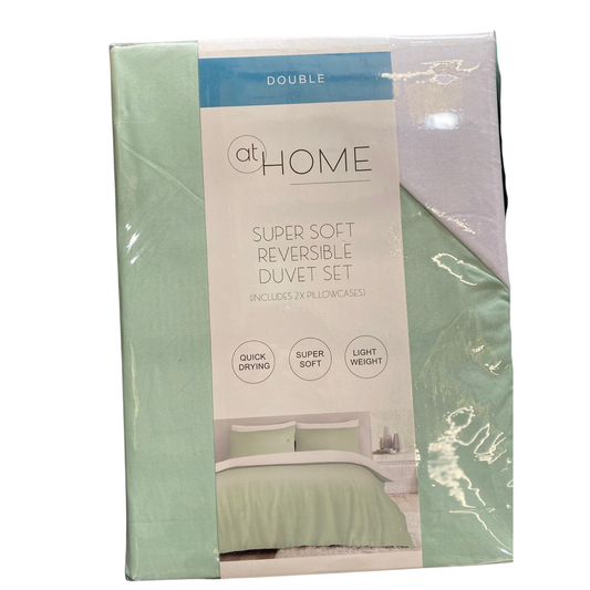 Packaged super soft reversible duvet set with 'at HOME' branding on a white background