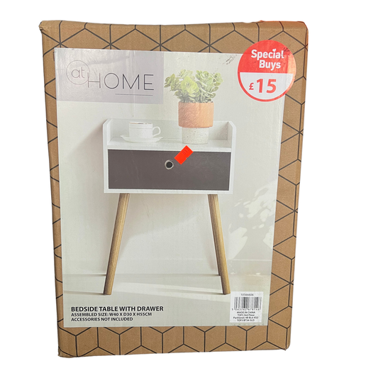 Packaged bedside table with drawer on a geometric patterned background